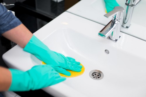 Staff training on safe cleaning methods and PPE use